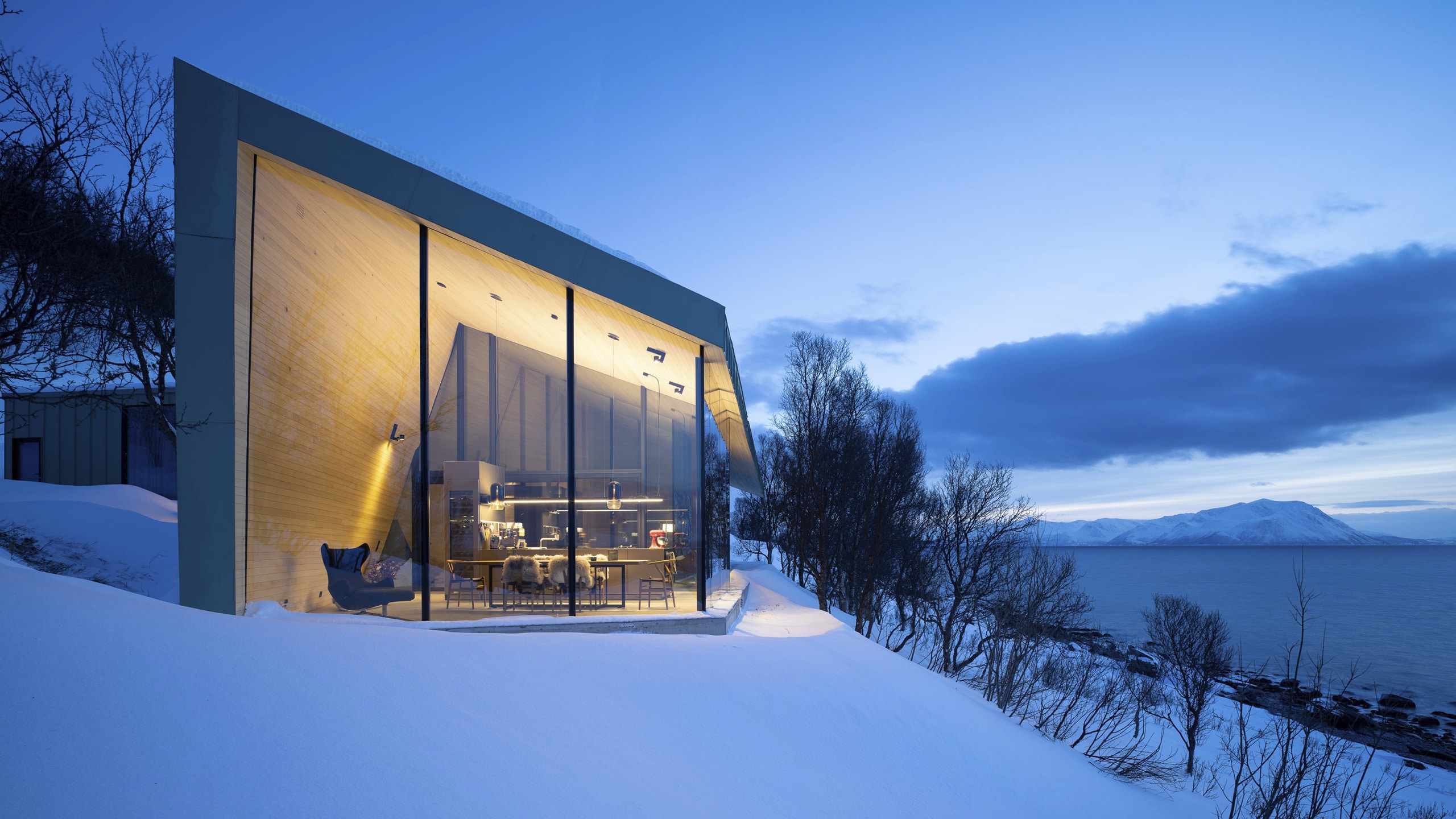 Snorre Stinessen Architecture's new contemporary cottage, built in a stunning seashore location on the Lyngen peninsula, facade made of Nordic Green alloys from Aurubis Finland